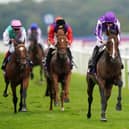 Seventh heaven: Ryan Moore and Continuous deny Frankie Dettori, left, on Arrest and Tom Marquand, right on Royal horse Desert Hero, to win a seventh Doncaster St Leger for trainer Aidan O'Brien.