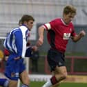Influential figure: Barry Miller, right, playing for Doncaster Rovers against Chester in December 2000. A quarter of a century on he is the club's chaplain.