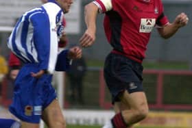 Influential figure: Barry Miller, right, playing for Doncaster Rovers against Chester in December 2000. A quarter of a century on he is the club's chaplain.