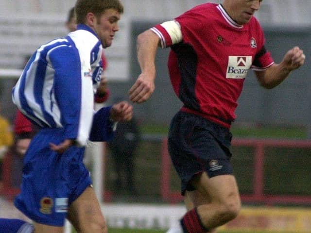 Influential figure: Barry Miller, right, playing for Doncaster Rovers against Chester in December 2000. A quarter of a century on he is the club's chaplain.