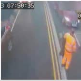 The car (right) is just inches away from the Doncaster Council bin worker after mounting the pavement.