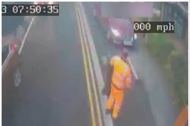 The car (right) is just inches away from the Doncaster Council bin worker after mounting the pavement.