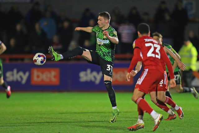 Doncaster Rovers' Caolan Lavery controls the ball against Crawley Town.
