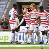 Doncaster's George Miller celebrates scoring against Crawley Town last time out.