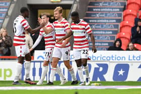 Doncaster's George Miller celebrates scoring against Crawley Town last time out.