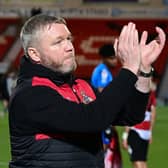 Doncaster Rovers manager Grant McCann applauds the fans at full time.