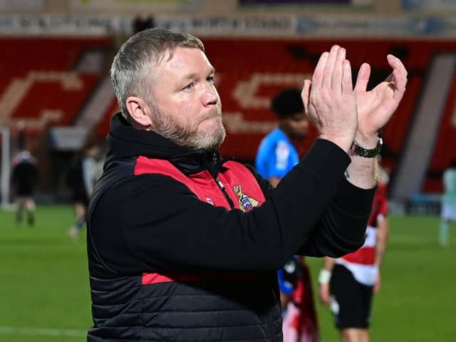 Doncaster Rovers manager Grant McCann applauds the fans at full time.