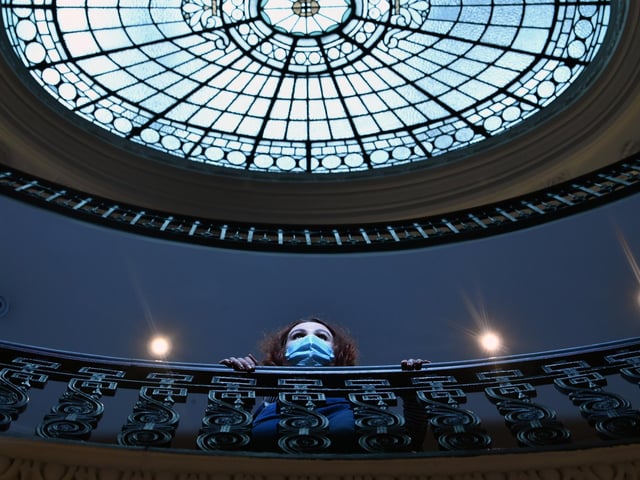 A visitor admires the architecture inside GOMA.