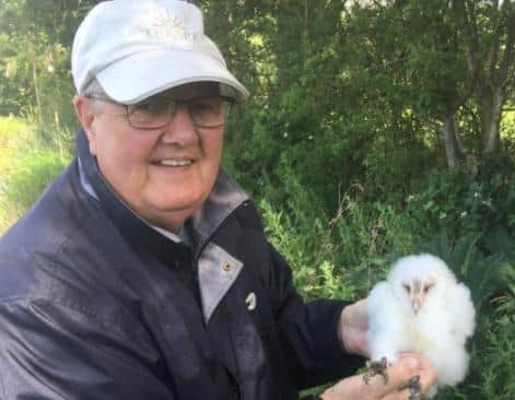 Graham Moss with an owl chick