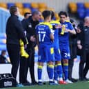 AFC Wimbledon boss Mark Robinson giving instructions to his players last season