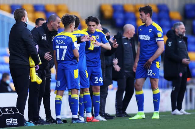 AFC Wimbledon boss Mark Robinson giving instructions to his players last season