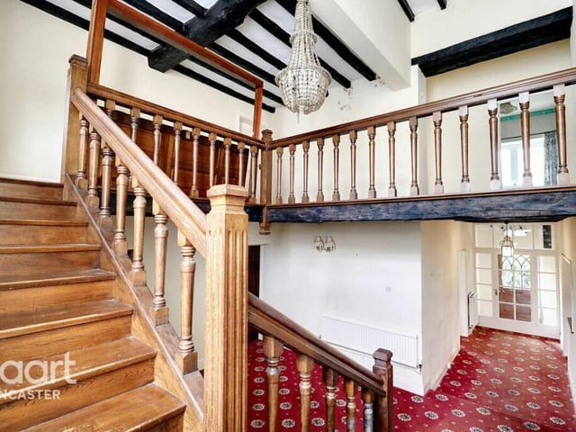 The hallway, staircase, and gallery landing.