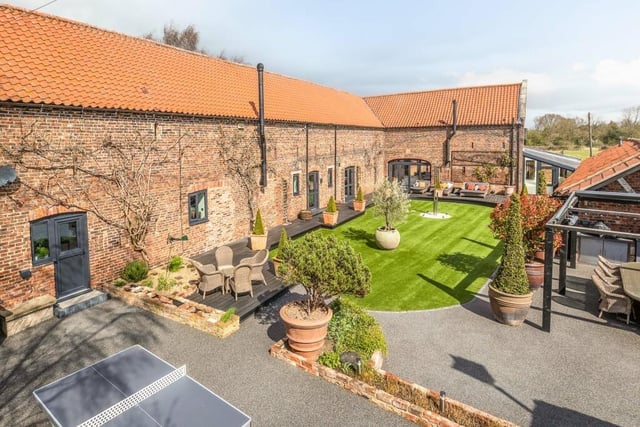 Overview of the property, with its host of garden entertaining facilities.