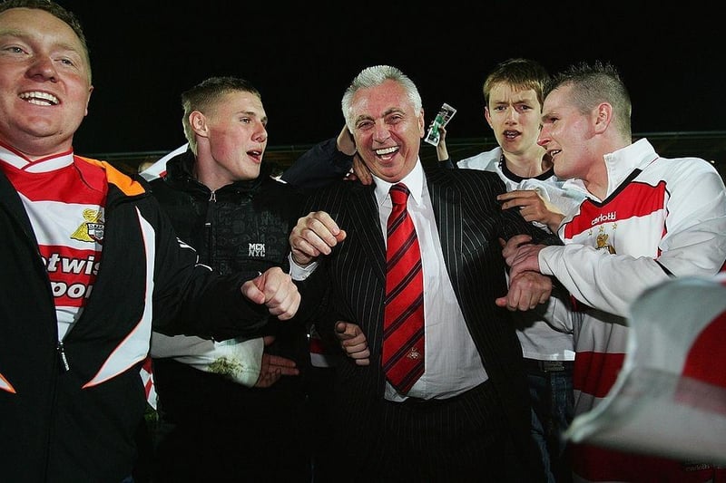 DONCASTER, UNITED KINGDOM - MAY 16:  John Ryan, Chairman of Doncaster Rovers, is mobbed by fans after the Coca-Cola League One Playoff Semi Final match between Doncaster Rovers and Southend United at the Keepmoat Stadium on May 16, 2008 in Doncaster, England.  (Photo by Matthew Lewis/Getty Images):o