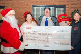 Martin Dent's Christmas lights switch on raised cash for the Yorkshire Air Ambulance.