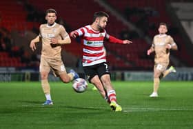 Luke Molyneux fires a shot at goal on a frustrating night for Grant McCann's side.