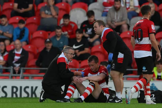 Tom Anderson receives treatment from the physio team.