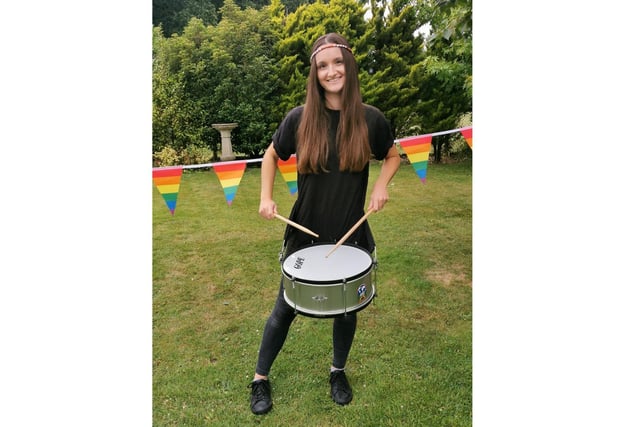 Immee Harvey practising her drumming