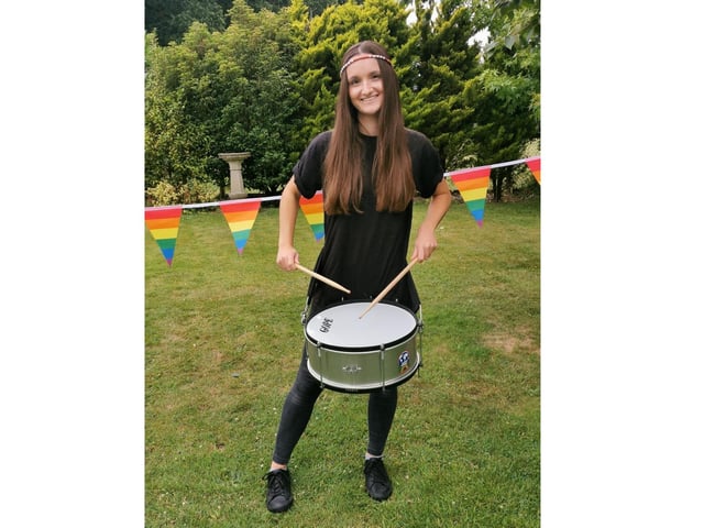 Immee Harvey practising her drumming