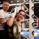 Terri Harper celebrates with the WBA and IBO world super-welterweight belts after defeating Hannah Rankin in Nottingham, England (photo by Nathan Stirk/Getty Images).