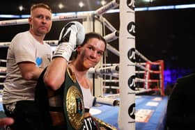 Terri Harper celebrates with the WBA and IBO world super-welterweight belts after defeating Hannah Rankin in Nottingham, England (photo by Nathan Stirk/Getty Images).