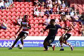 Zain Westbrooke has a shot at goal for Doncaster Rovers against Swindon Town.