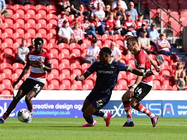 Zain Westbrooke has a shot at goal for Doncaster Rovers against Swindon Town.