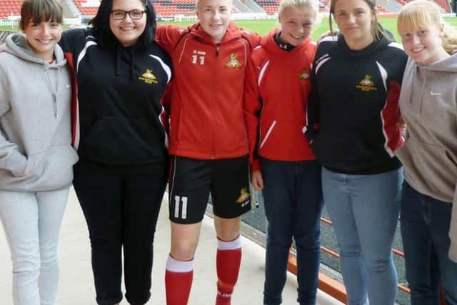 Wattam, third from right, pictured with Lioness and former Doncaster Rovers Belles forward Beth England.