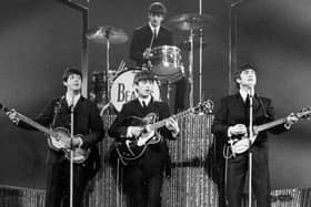 The Beatles on stage at the London Palladium. (Photo by Michael Webb/Getty Images)