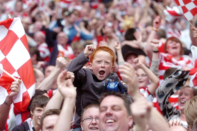 A young Rovers fan celebrates promotion at Wembley