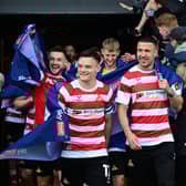 Owen Bailey and Richard Wood (right) lead the post-match lap of appreciation after Rovers' promotion against Bradford. Pic: Howard Roe.