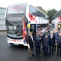 John Healey visited the depot to unveil the buses decorated with poppies.