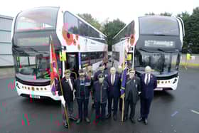 John Healey visited the depot to unveil the buses decorated with poppies.