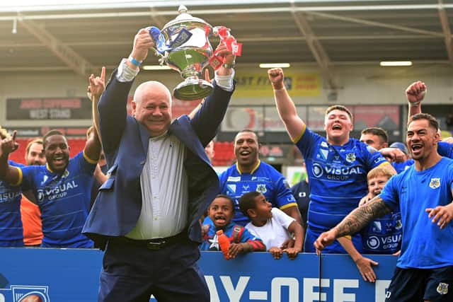 Dons chief executive Carl Hall celebrates promotion.