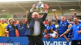 Dons chief executive Carl Hall celebrates promotion.