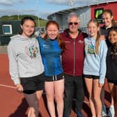 Barry Barnes with some of the young female runners in his coaching group.