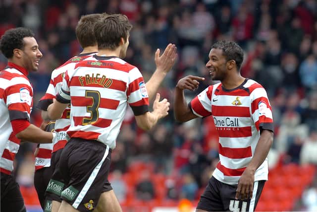 Brown celebrates with Habib Beye, one of the signings to arrive as part of the experiment at Doncaster Rovers