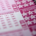 National Lottery are on the hunt for an unclaimed millionaire 