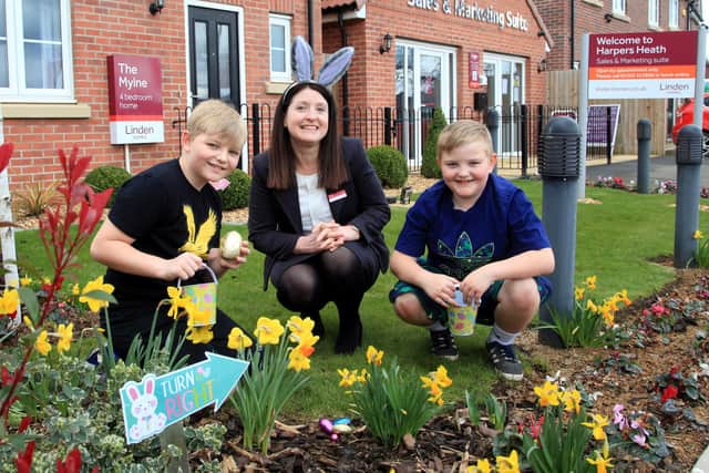 Linden Homes sales executive Joanne with Harper’s Heath Easter egg hunters, friends Bailey (nine) and James (eight)
