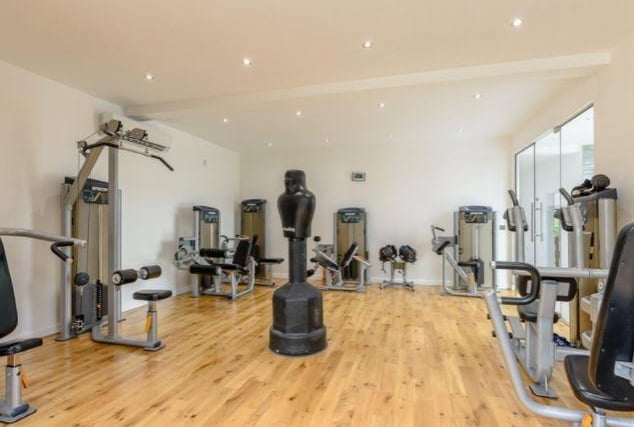 The fully equipped home gym is large enough to accommodate numerous machines, but could also be used as an additional reception room or home office.