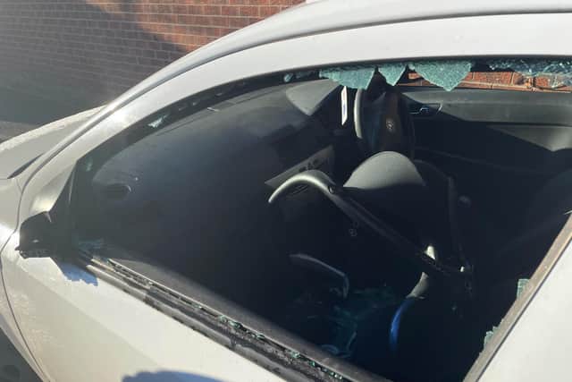 The passenger's side window was smashed in the incident. Picture by Tom Richards