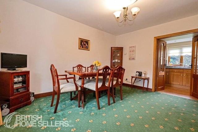 The dining room opens to the kitchen, and has space for a larger style dining suite.