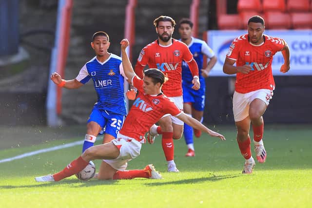 Rodrigo Vilca is tackled by Charlton Athletic's George Dobson. Picture: Gareth Williams/AHPIX
