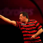 Dennis Priestley in action during the Ladbrokes.com World Darts Championship in 2012.