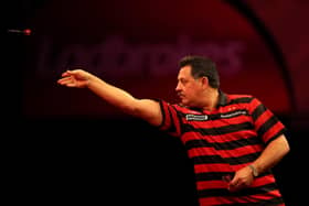 Dennis Priestley in action during the Ladbrokes.com World Darts Championship in 2012.