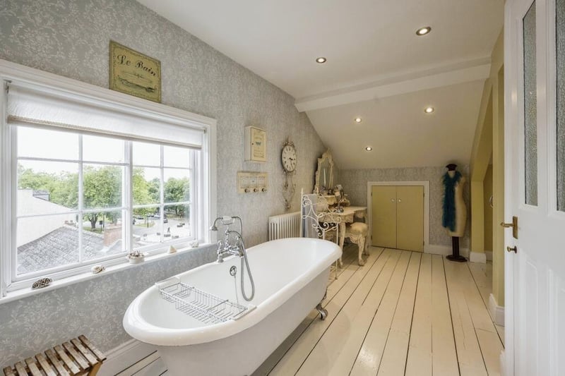Another of the property's bathrooms, with a free standing roll-top bath.