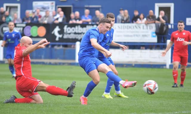 Danny Deakin puts Rossington Main ahead against FC Humber United. Photo: Russ Sheppard/Offthebenchpics