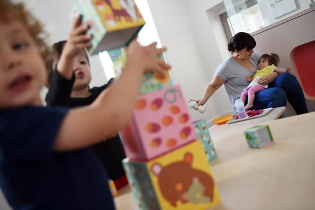 The new coronavirus restrictions include exemptions for childcare (Photo by LOIC VENANCE/AFP via Getty Images)