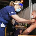 Sally Conlan Deputy Nurse Director for the Covid 19 Vaccination Programme vaccinates Colin Moss  at the Covid 19 max vaccination centre which has opened at the Sheffield Arena. Picture Scott Merrylees