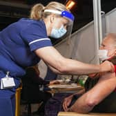 Sally Conlan Deputy Nurse Director for the Covid 19 Vaccination Programme vaccinates Colin Moss  at the Covid 19 max vaccination centre which has opened at the Sheffield Arena. Picture Scott Merrylees